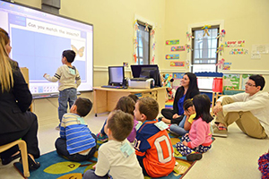 TSC childcare center distributes backpacks to help families.